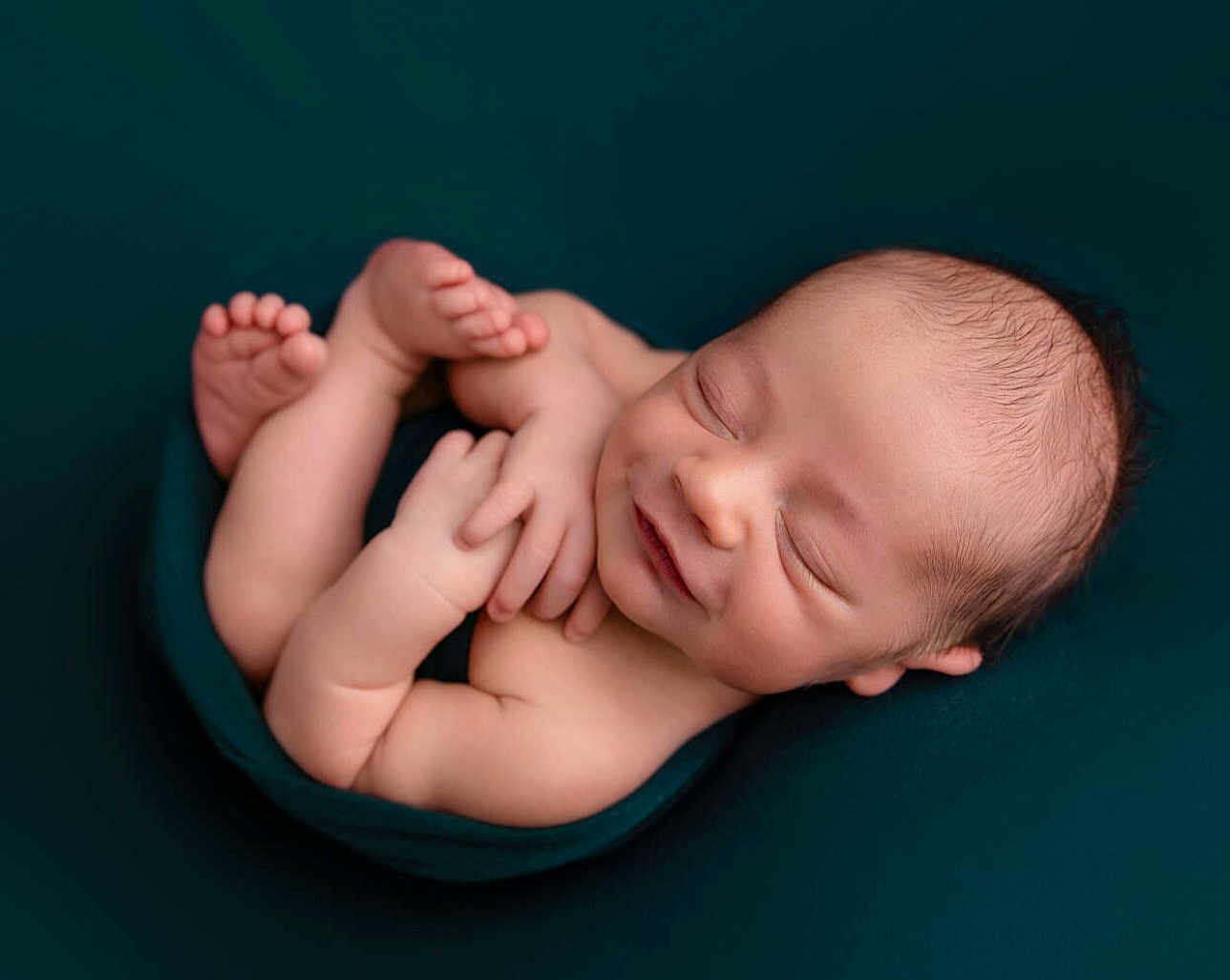 Reese joined the competition — help win amazing prizes! newborn, baby, sleeping, smiling, infant, blanket, cozy, cute, peaceful, portrait, skin, head, hands, feet, closed_eyes, rest, comfort, child, young, soft