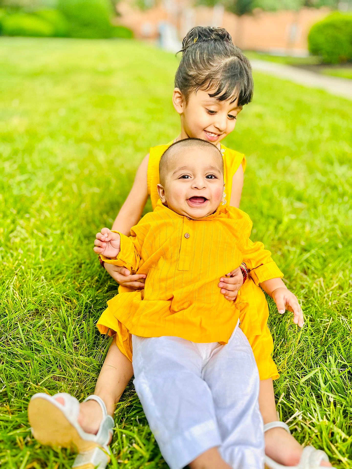 Azlan joined the competition — help win amazing prizes! child, children, baby, grass, outdoor, smiling, happy, yellow_clothing, sitting, cute, family, love, nature, playful, summer, portrait, toddler, feet, grass_field, daylight