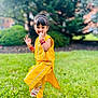 Aakifa is registered to the contest to win money with this photo: child, girl, yellow_clothing, grass, outdoor, smiling, playful, pose, greenery, nature, happy, sandals, bracelets, daylight, young, cute, fashion, portrait, person, background_blur