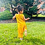 Aakifa joined the competition — help win amazing prizes! child, girl, yellow_clothing, grass, outdoor, greenery, dress, sandals, hairup, playful, nature, daylight, tree, lawn, movement, back_view, joyful, bangle, summer, park