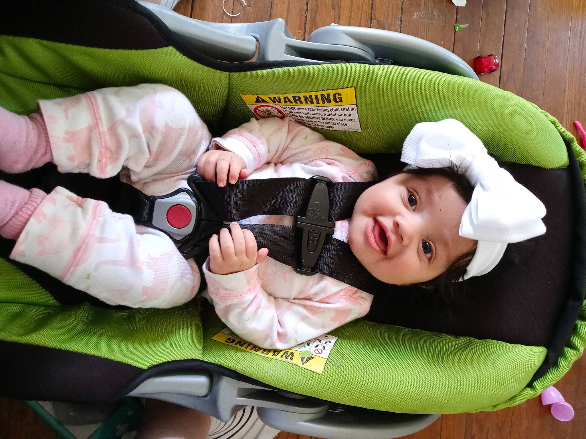 Chanel is registered to the contest to win money with this photo: baby, baby_carriage, baby_in_car_seat, baby_products, baby_safety, baby_sleeping, baby_toddler_clothing, car_seat, child, comfort, finger, fun, gesture, green, happy, headwear, lap, linens, person, sleeve