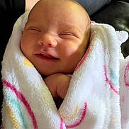 Vivian is registered to the contest to win money with this photo: newborn, baby, blanket, wrapped, smiling, face, infant, cute, cozy, soft, child, person, portrait, head, skin, resting, peaceful, indoor, comfort, sleepy