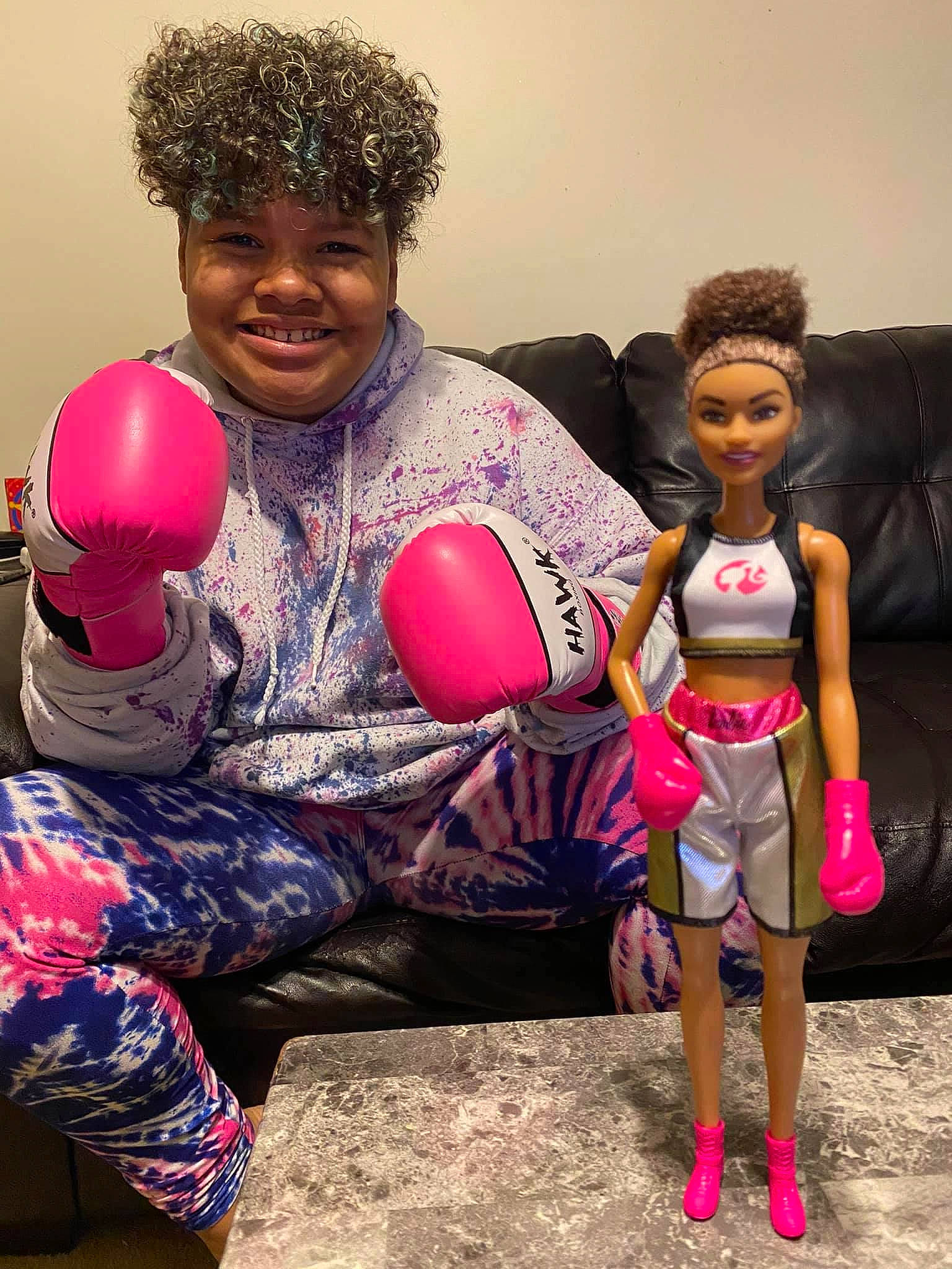 Aiyanna joined the competition — help win amazing prizes! afro, black_hair, child, doll, fun, hair, hairstyle, headwear, joy, person, pink, play, smile, toddler, toy, vacation