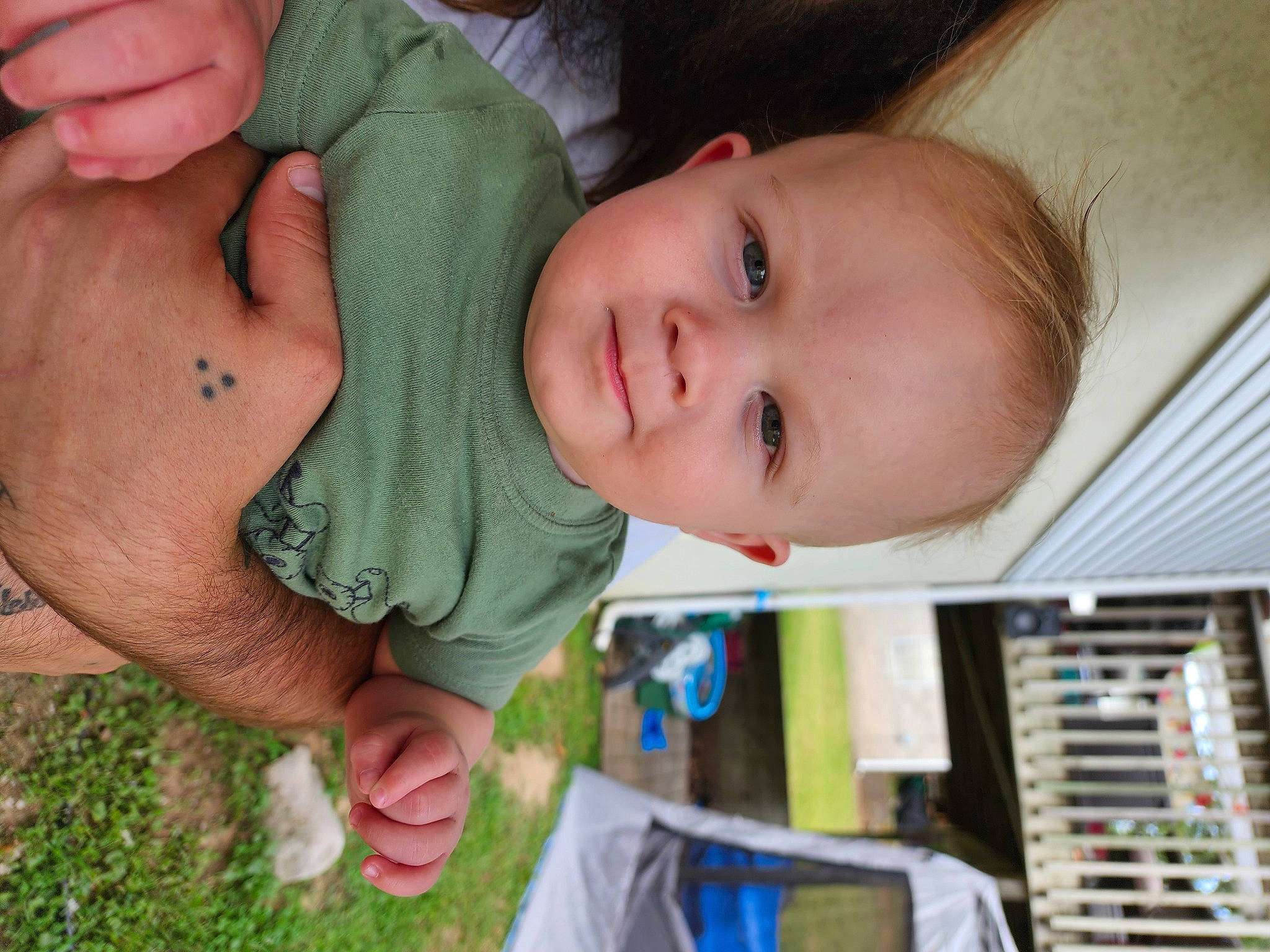 Kobe is registered to the contest to win money with this photo: baby, baby_toddler_clothing, cheek, child, facial_expression, finger, gesture, grass, hand, happy, iris, lip, mouth, nose, person, plant, product, skin, smile, toddler