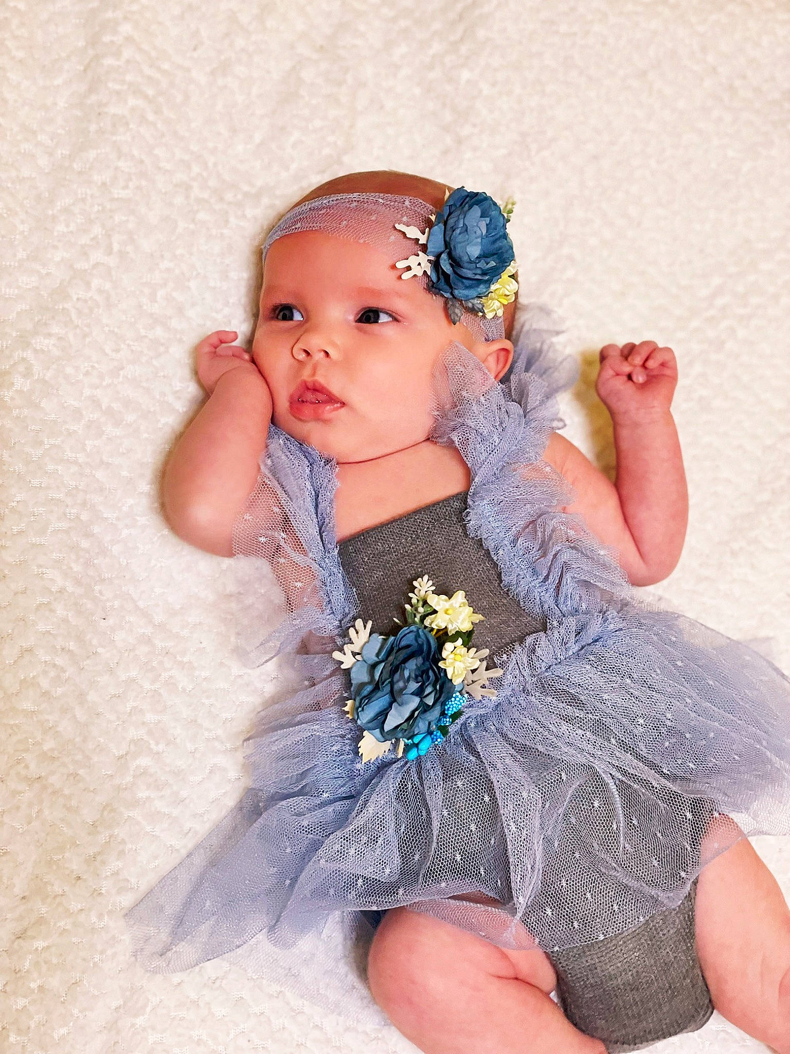 Ryli is registered to the contest to win money with this photo: baby_toddler_clothing, day_dress, dress, embellishment, eyelash, fashion_design, finger, flash_photography, hand, happy, head, headband, headpiece, headwear, iris, jewellery, person, petal, pink, skin