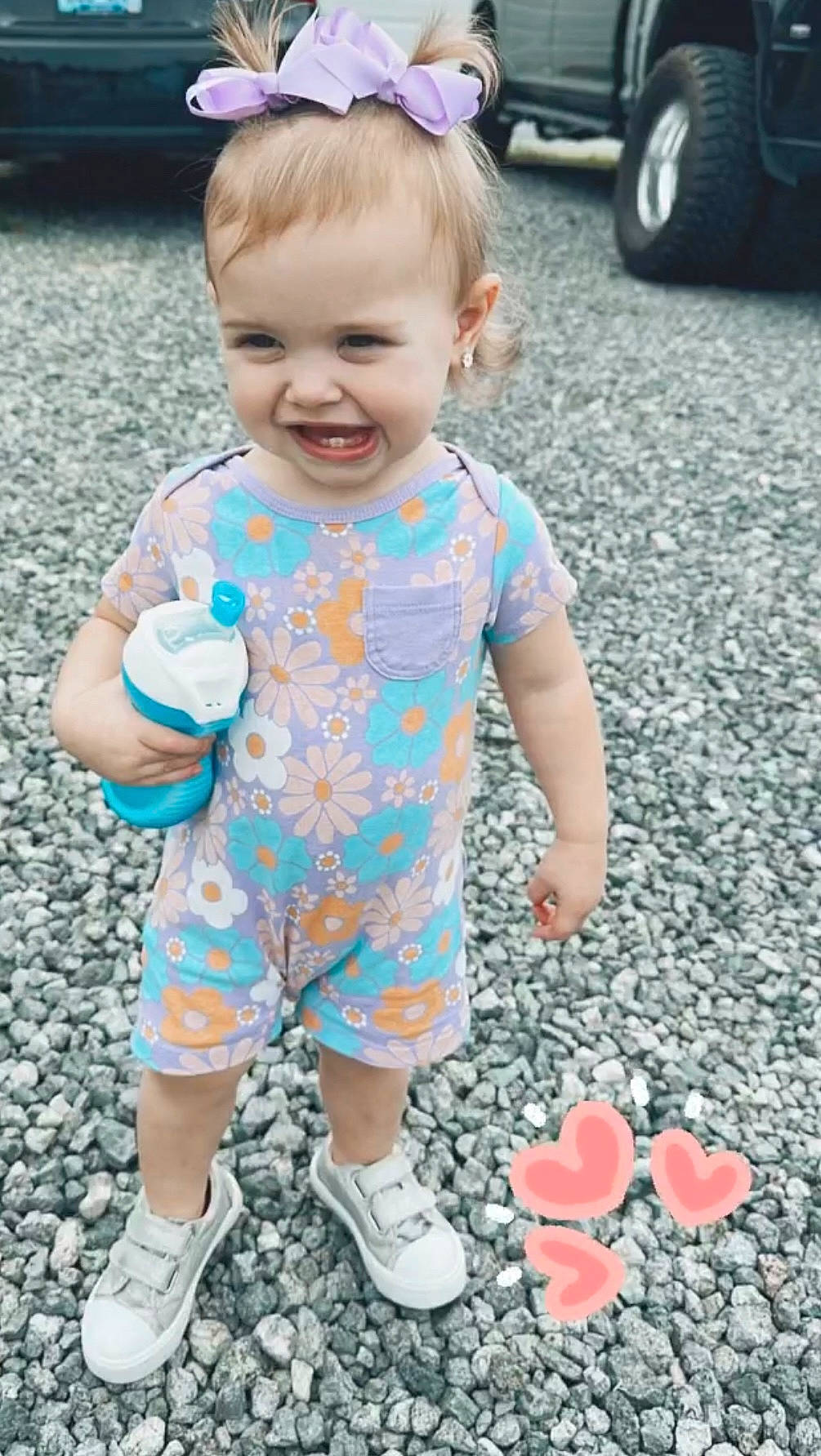 Lulamae is registered to the contest to win money with this photo: arm, baby, baby_toddler_clothing, blue, cool, eye, fun, grass, hairstyle, hand, happy, joy, people_in_nature, person, photograph, pink, skin, sleeve, smile, t_shirt