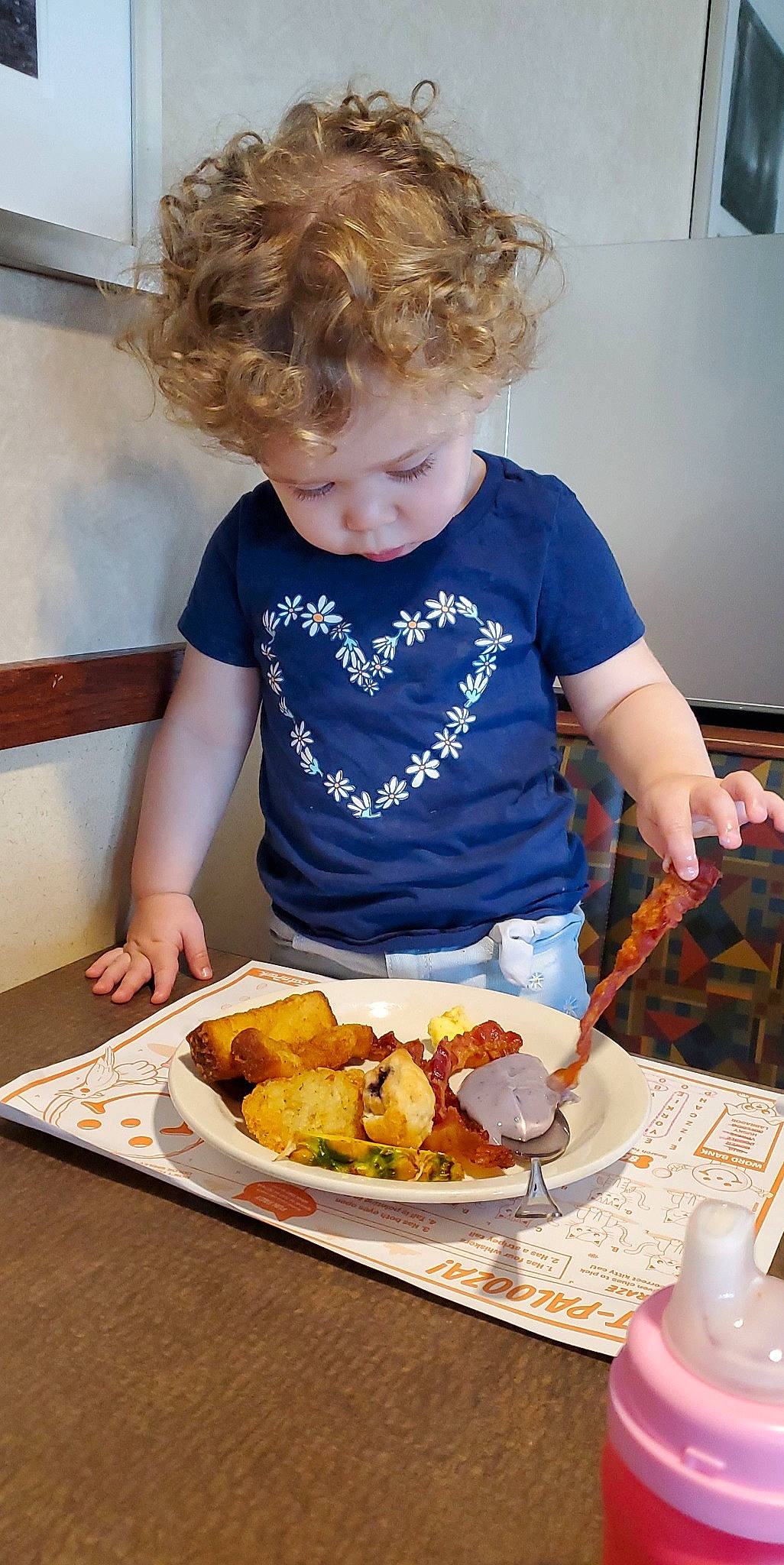 Melissa is registered to the contest to win money with this photo: chair, comfort_food, cooking, cuisine, dish, finger_food, food, food_craving, fork, fried_food, ingredient, junk_food, person, plate, recipe, saucer, sharing, t_shirt, table, tableware