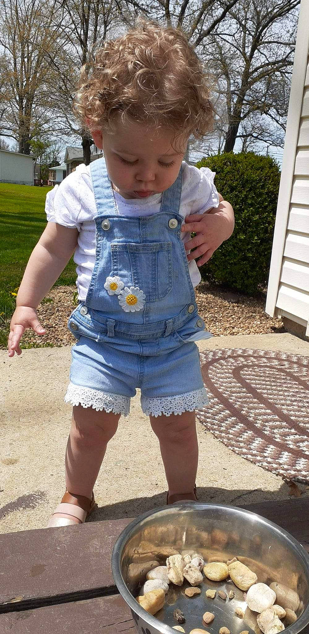 Melissa is registered to the contest to win money with this photo: baby_toddler_clothing, child, cooking, denim, electric_blue, grass, human_leg, leg, leisure, pattern, person, plant, recreation, shorts, sleeve, standing, t_shirt, thigh, toddler, tree