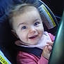 Abigail is registered to the contest to win money with this photo: baby, car_seat, child, closeup, clothing, cute, face, hands, happy, indoors, infant, person, pink, portrait, safety, seat, seat_belt, smile, warning_label, young_child
