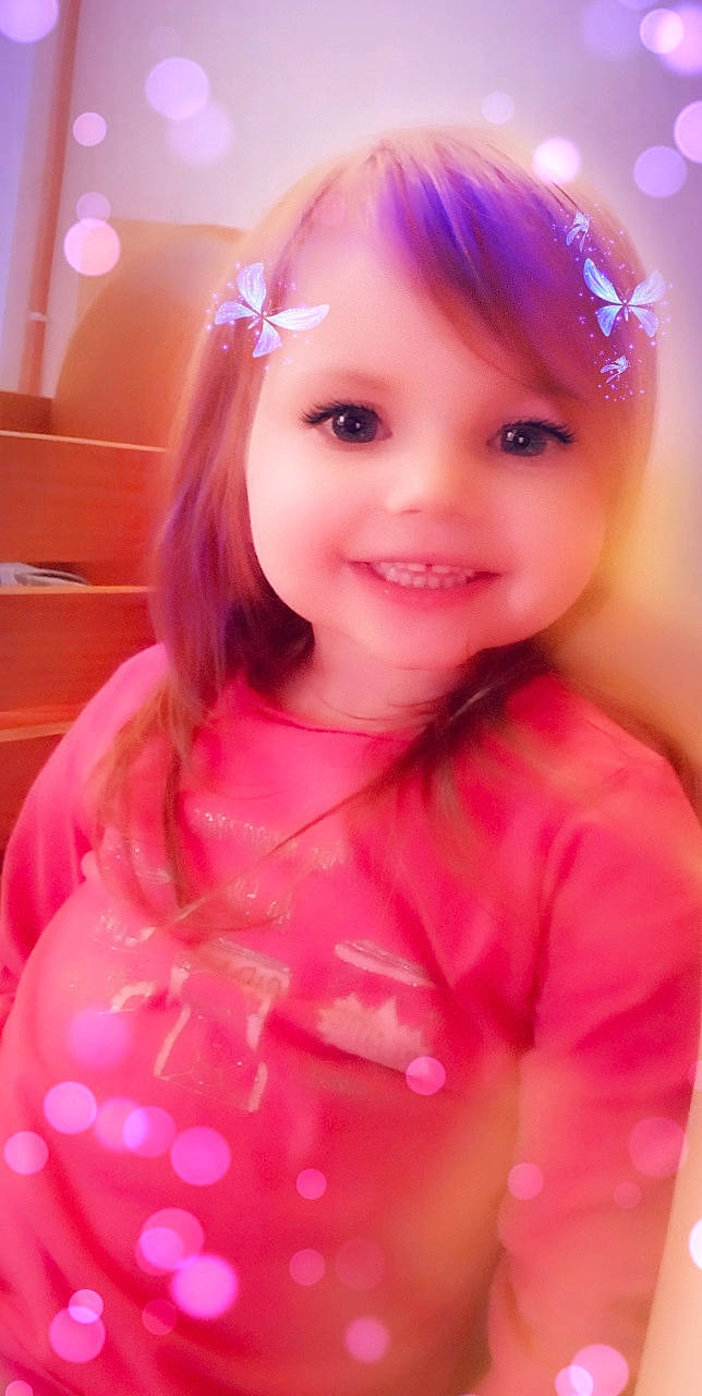 Elena participe au concours pour gagner de l'argent avec cette photo : baby_toddler_clothing, beauty, dress, event, eyebrow, eyelash, face, happy, headgear, headpiece, human_body, iris, joy, lip, long_hair, magenta, person, pink, skin, sleeve