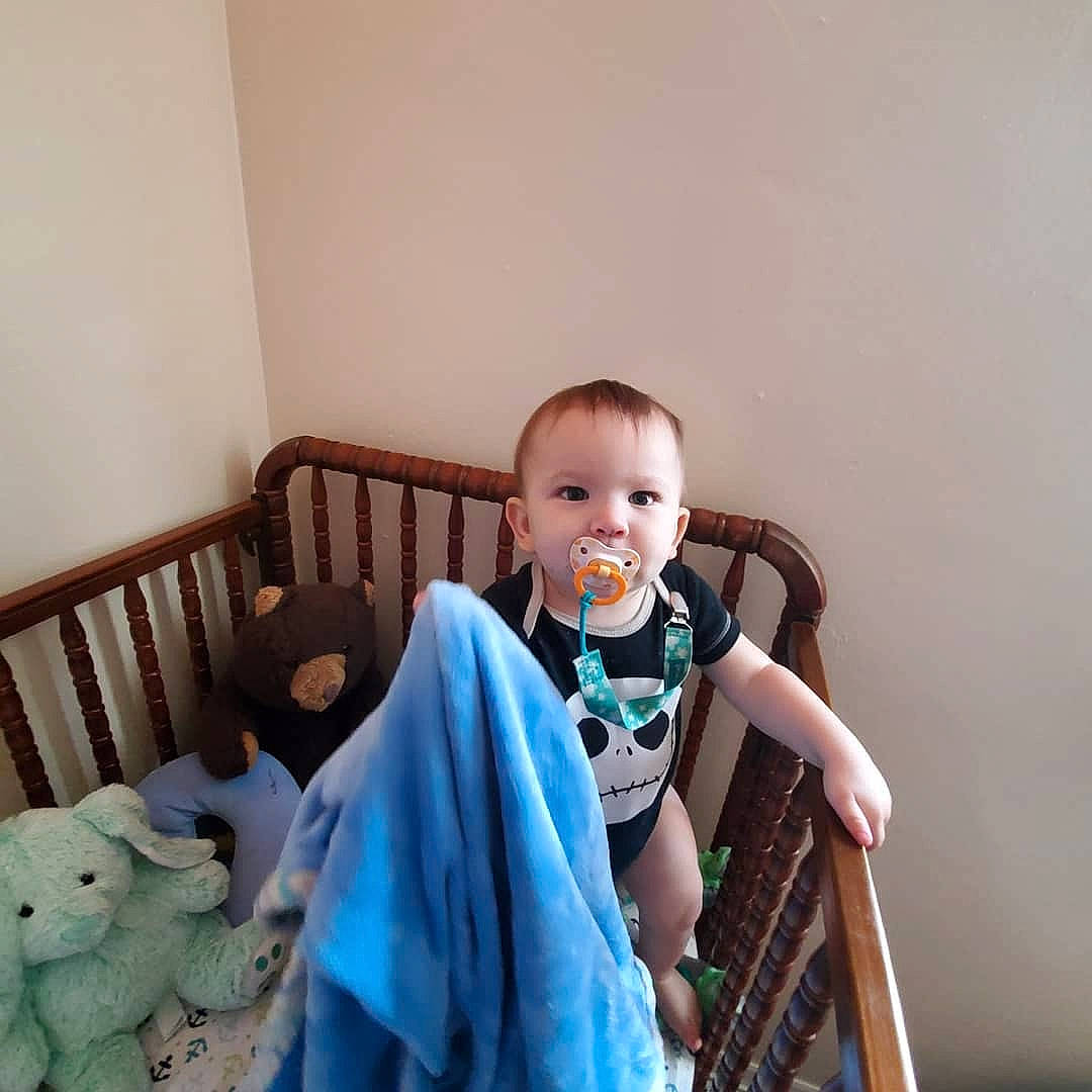 Luke is registered to the contest to win money with this photo: baby, baby_products, baby_safety, chair, child, furniture, happy, infant_bed, person, product, room, sitting, skin, smile, toddler