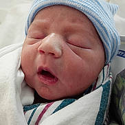Declan joined the competition — help win amazing prizes! newborn, baby, infant, swaddled, blanket, beanie, striped_hat, sleeping, closeup, face, hospital, soft_skin, mouth_open, wrapped, person, cute, fresh, small, peaceful, child