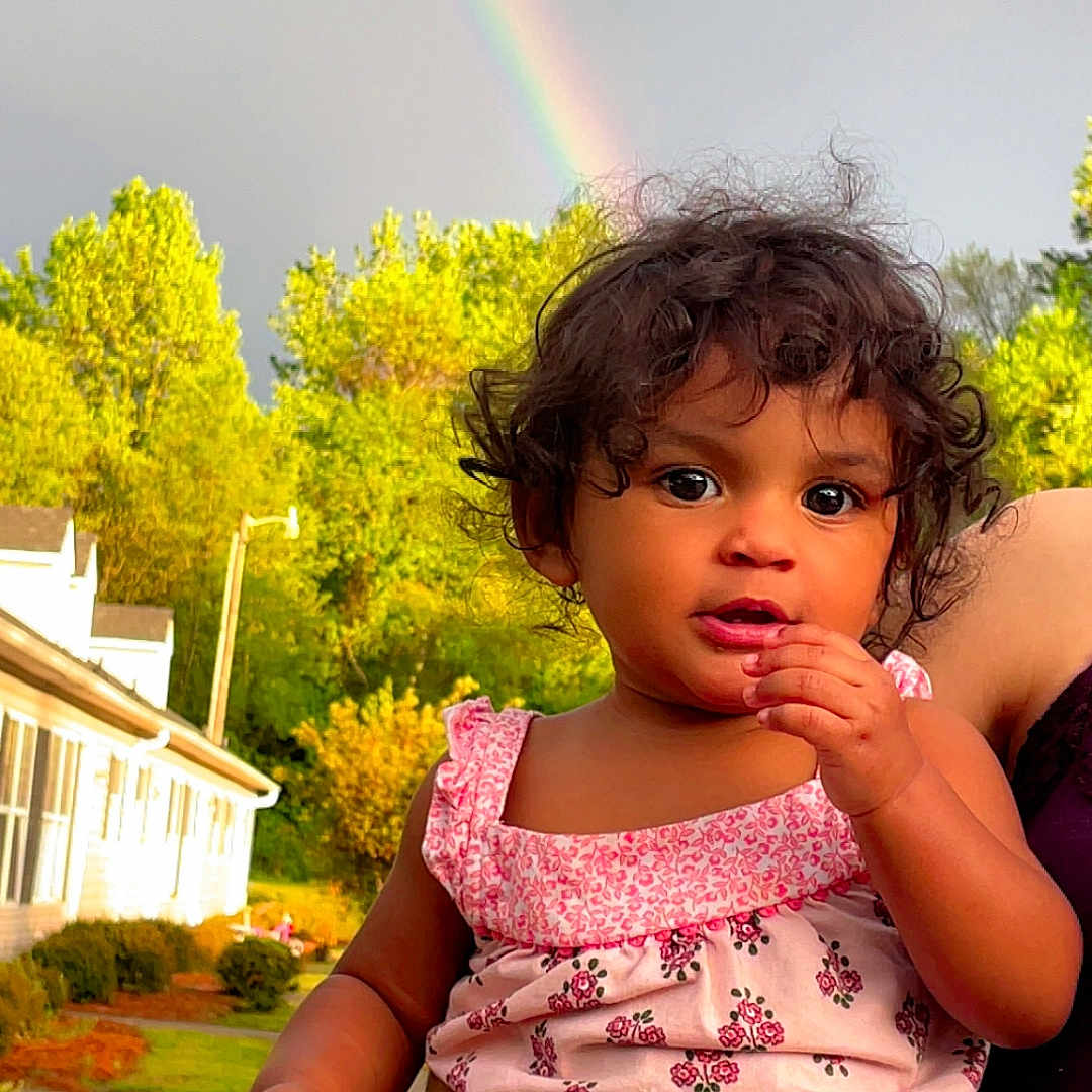Selena joined the competition — help win amazing prizes! bodypart, child, clothing, dress, face, female, finger, girl, grass, hand, head, nature, outdoors, path, person, photography, plant, portrait, sidewalk, sky