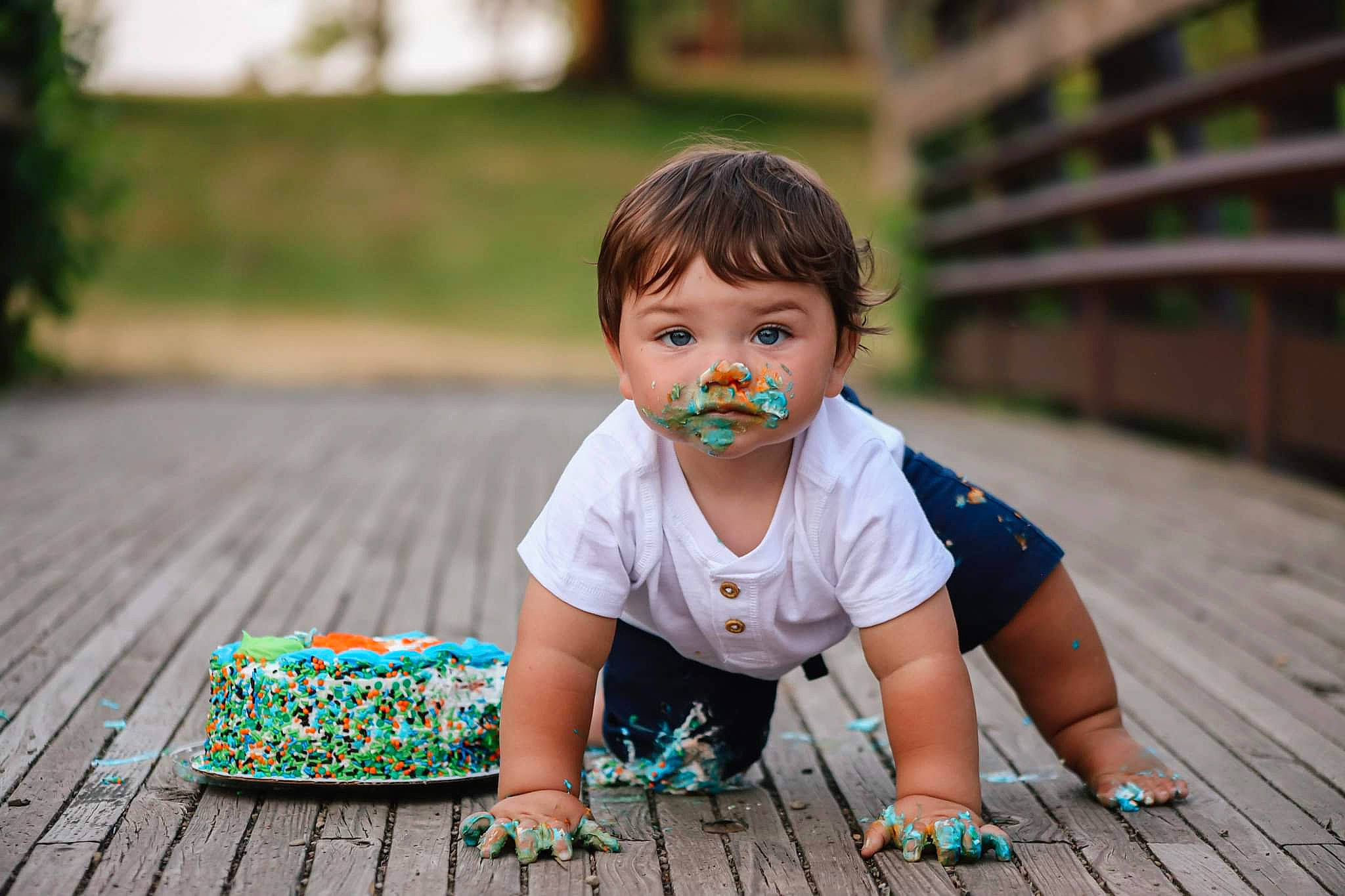 Kashton is registered to the contest to win money with this photo: baby, baby_toddler_clothing, child, flash_photography, flooring, grass, green, happy, leisure, pattern, people, person, plant, sitting, skin, smile, snapshot, summer, t_shirt, toddler