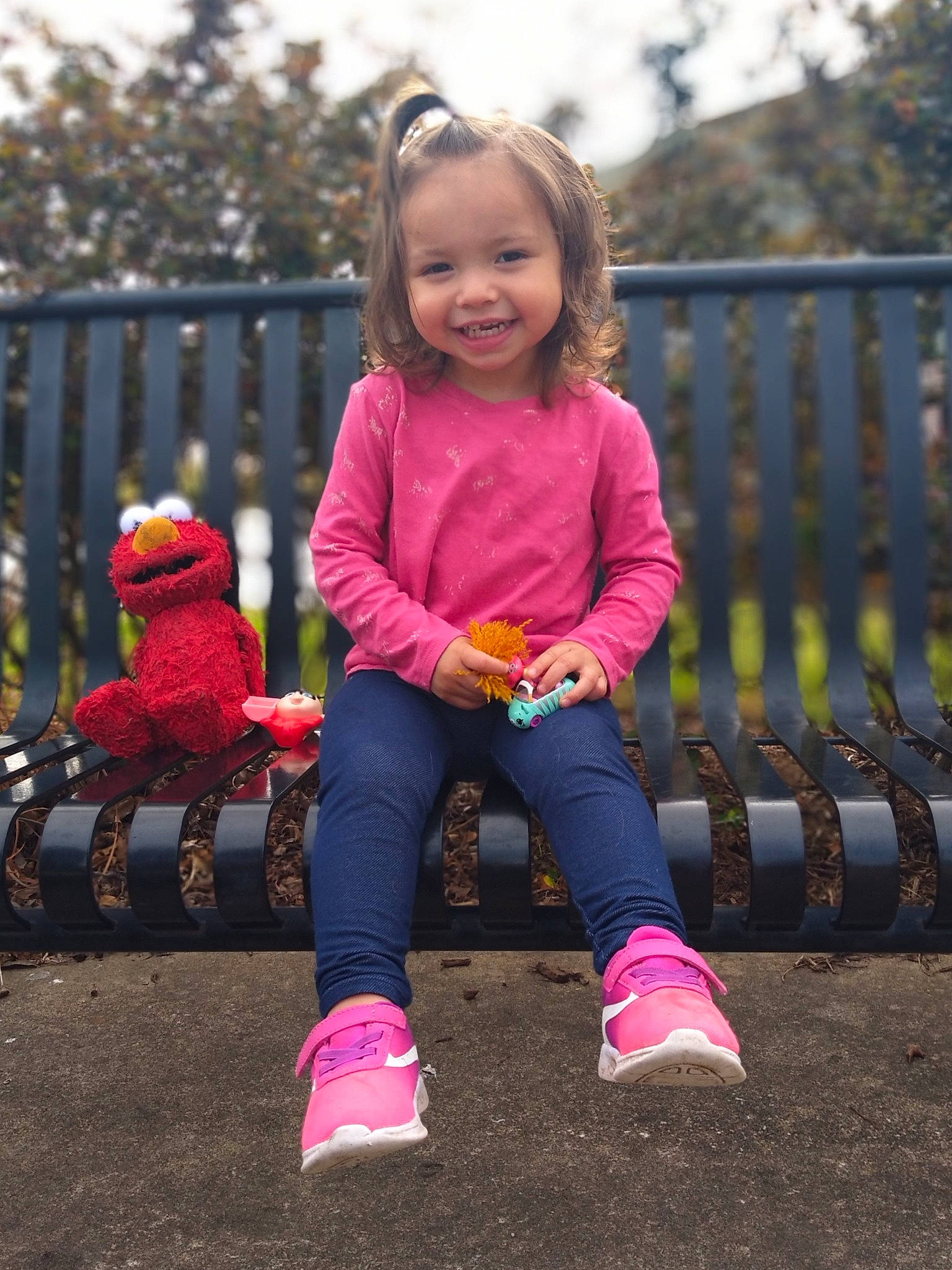 Adalynn joined the competition — help win amazing prizes! baby_toddler_clothing, clothing, face, facial_expression, fence, grass, hair, happy, head, jeans, joy, nature, outerwear, people_in_nature, person, pink, plant, purple, shoe, sleeve