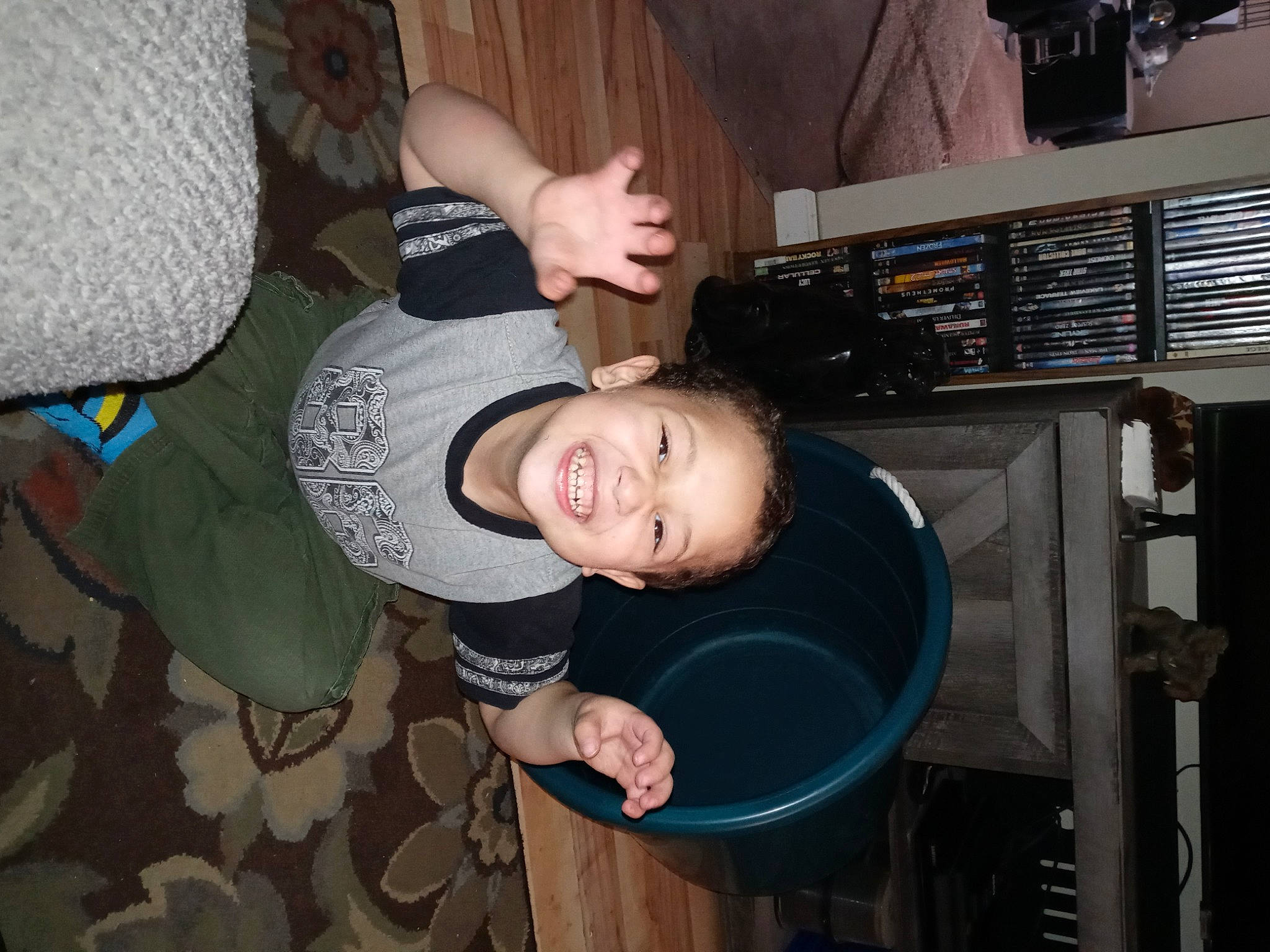 Isaiah is registered to the contest to win money with this photo: arm, audio_equipment, child, comfort, couch, elbow, engineering, flash_photography, fun, happy, joint, joy, machine, organ, person, room, sitting, smile, t_shirt, toddler