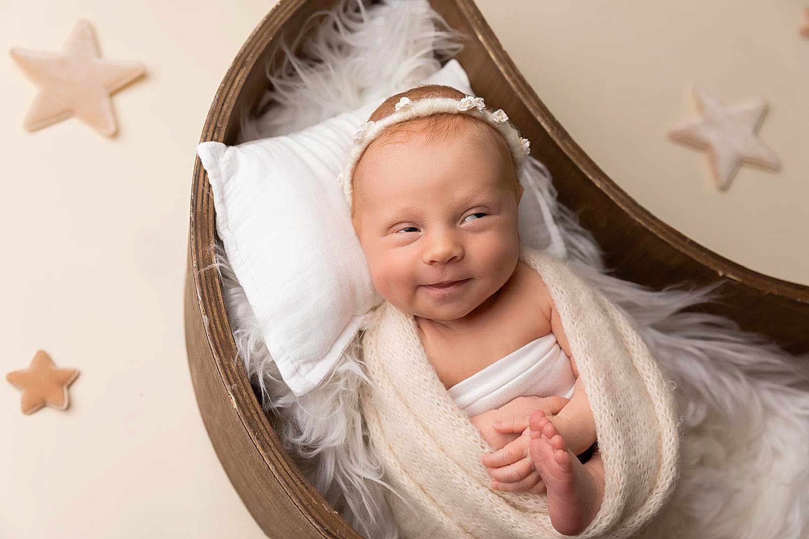 Elina is registered to the contest to win money with this photo: newborn, baby, infant, wrapped, blanket, headband, wooden_bowl, fur, star_decor, smile, cute, portrait, soft_texture, sleepy, cozy, indoors, skin, hands, feet, decor