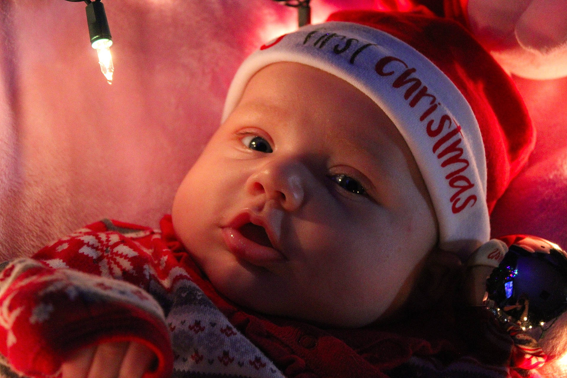 Elora is registered to the contest to win money with this photo: baby, cap, cheek, child, close_up, comfort, event, eyelash, flash_photography, fun, happy, headgear, headwear, iris, lip, mouth, nose, person, red, skin