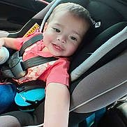 Bryan joined the competition — help win amazing prizes! baby, bottle, car_interior, car_seat, child, cute, happy, infant, person, pink_shirt, road_trip, safety, seat, seatbelt, short_hair, smiling, sunlight, toddler, travel, window