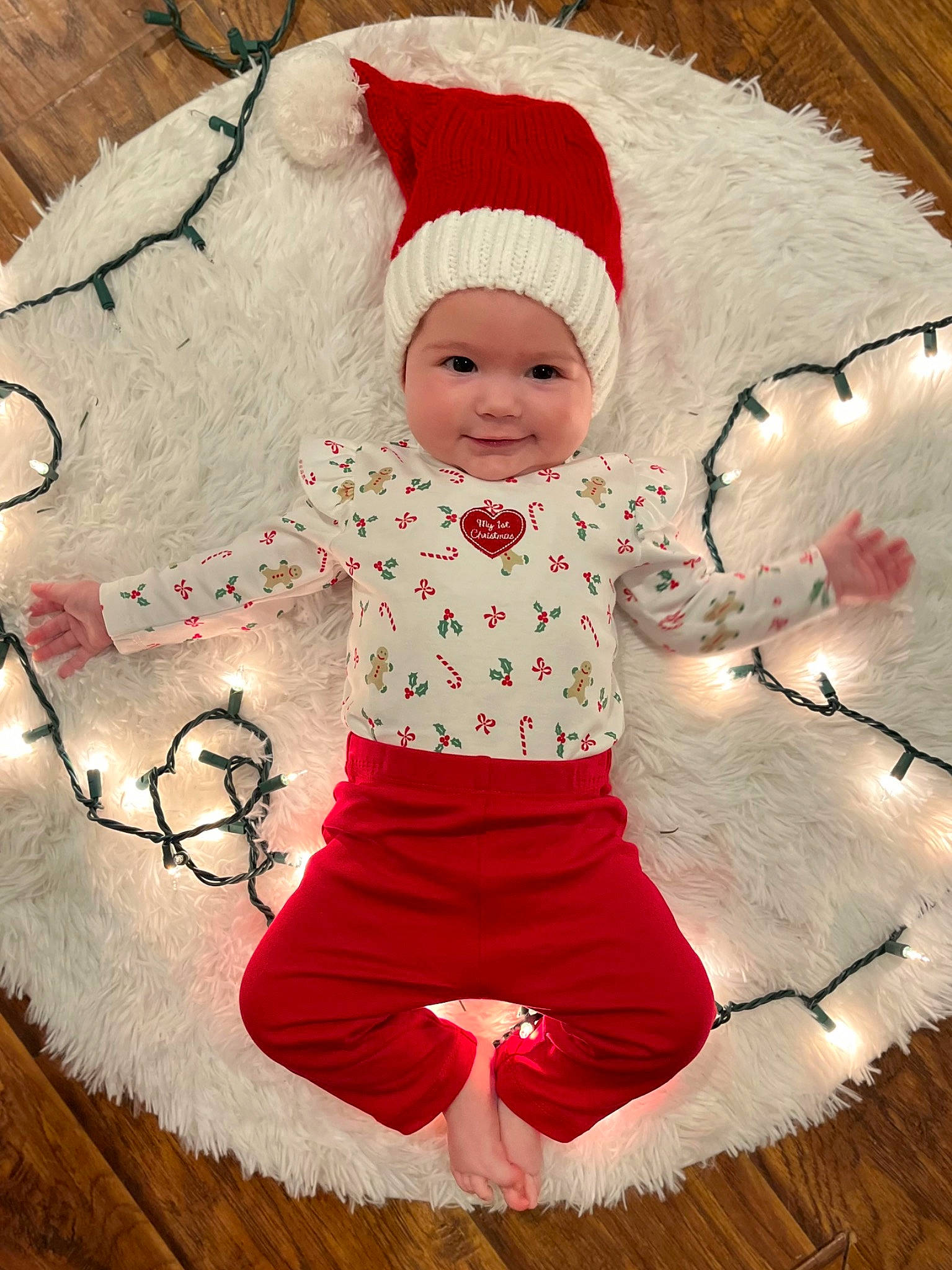Lillian is registered to the contest to win money with this photo: baby, baby_toddler_clothing, cap, child, christmas, costume_hat, event, happy, headgear, headwear, joy, magenta, outerwear, pattern, person, pink, red, sleeve, smile, textile