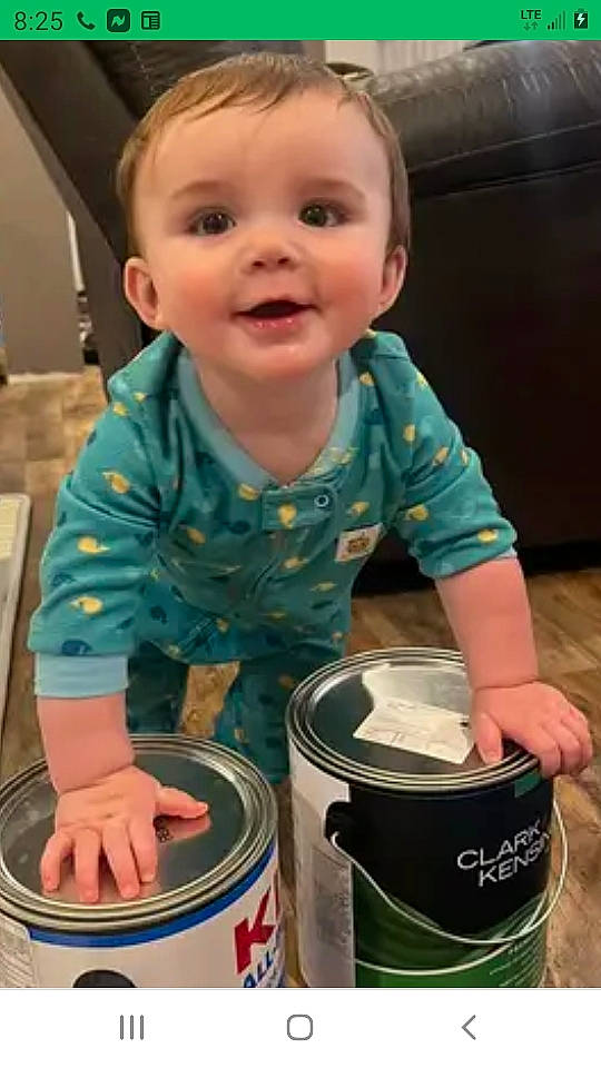 Slade is registered to the contest to win money with this photo: aluminum_can, baby, baby_toddler_clothing, beverage_can, bucket, cheek, child, drink, drinkware, fun, green, paint, person, photograph, smile, t_shirt, tin, tin_can, toddler, waste_container