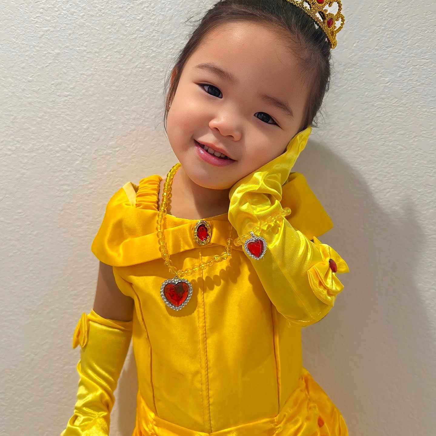 Sophia is registered to the contest to win money with this photo: accessories, celebration, child, costume, cute, dress_up, fashion, girl, gloves, happy, indoor, jewelry, playful, portrait, pose, princess, smile, tiara, yellow_dress, young