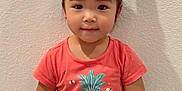 Sophia joined the competition — help win amazing prizes! child, girl, smile, headband, minnie_mouse_ears, red_bow, pineapple_shirt, sitting, wall, texture, black_pants, hand, finger_sticker, indoor, cute, portrait, young, happy, casual_clothing, person