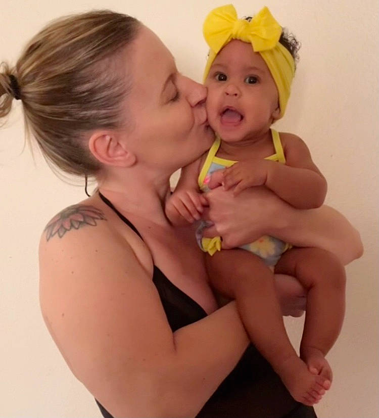 Anaya is registered to the contest to win money with this photo: baby, cheek, ear, face, finger, gesture, happy, hat, head, headwear, iris, kiss, lip, mouth, neck, nose, organ, people, person, skin