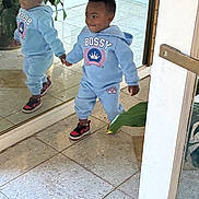 Aniyah joined the competition — help win amazing prizes! toddler, child, reflection, mirror, indoor, floor, tile, plant, hoodie, clothing, sneakers, walking, cute, smiling, person, young_child, casual_wear, home, holding_hands, reflection_image