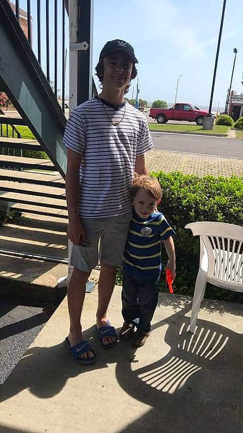 Cayden is registered to the contest to win money with this photo: child, footwear, joy, leg, person, photography, shoe, smile, toddler, vacation