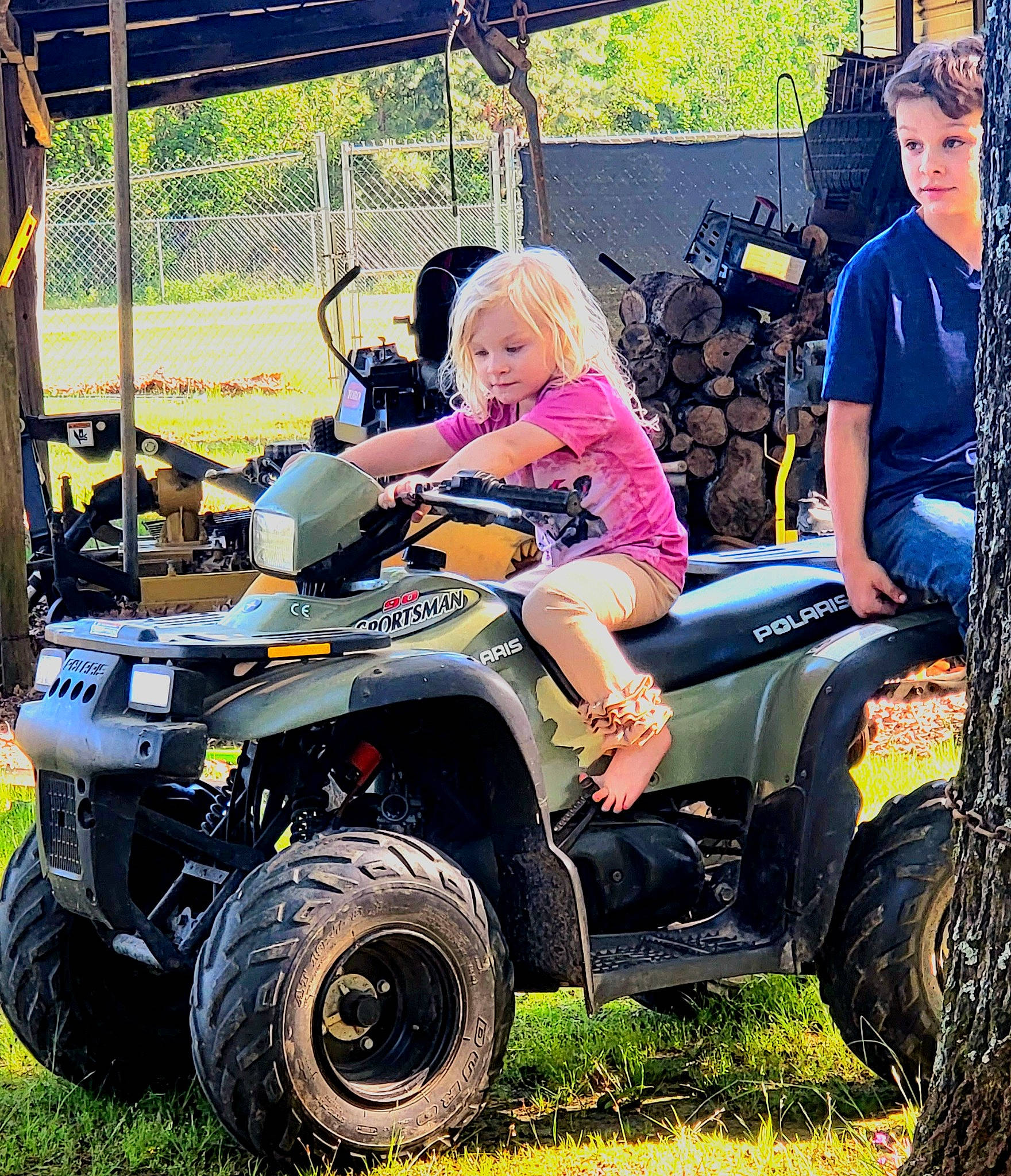 Gracelynn joined the competition — help win amazing prizes! automotive_design, automotive_exterior, automotive_tire, automotive_wheel_system, beauty, fender, grass, mode_of_transport, motor_vehicle, motorcycle, nature, person, plant, rim, shorts, t_shirt, tire, tread, tree, vehicle