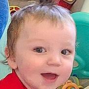 Kaleb is registered to the contest to win money with this photo: baby, background, child, colorful, cute, expression, eyes, face, hair, happy, indoor, joy, mouth_open, person, playtime, red_clothing, skin, smiling, toddler, toy