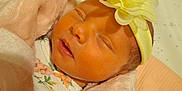 Kaylee joined the competition — help win amazing prizes! newborn, baby, sleeping, blanket, headband, flower, crib, soft, pink, yellow, face, infant, cute, peaceful, wrapped, child, bed, clothing, closeup, portrait