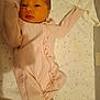 Kaylee is registered to the contest to win money with this photo: baby, newborn, onesie, pink_clothing, lying_down, face, infant, bed, blanket, star_pattern, soft_toy, baby_bottle, crib, sleepwear, cute, small, child, portrait, indoors, resting
