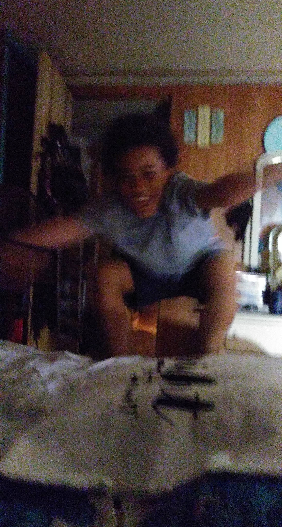 Keontae joined the competition — help win amazing prizes! comfort, guitar, joy, linens, living_room, person, plucked_string_instruments, room, sitting, snapshot, string_instrument, under_exposed