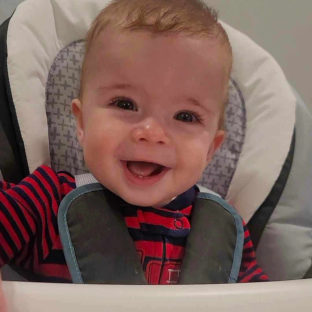 Zane joined the competition — help win amazing prizes! baby, babylaughing, chair, clothing, coat, cushion, cutlery, face, furniture, happy, head, homedecor, jacket, laughing, lifejacket, person, photography, portrait, smile, vest