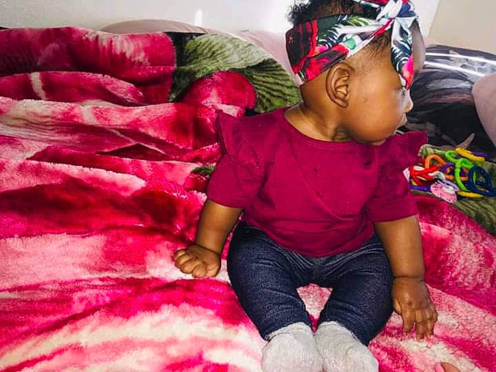 Janayah joined the competition — help win amazing prizes! baby, child, hair_accessory, headwear, magenta, mouth, person, pink, textile, toddler
