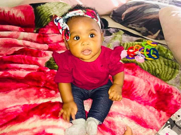 Janayah is registered to the contest to win money with this photo: baby, cheek, child, hair_accessory, headgear, magenta, mouth, person, pink, play, smile, textile, toddler