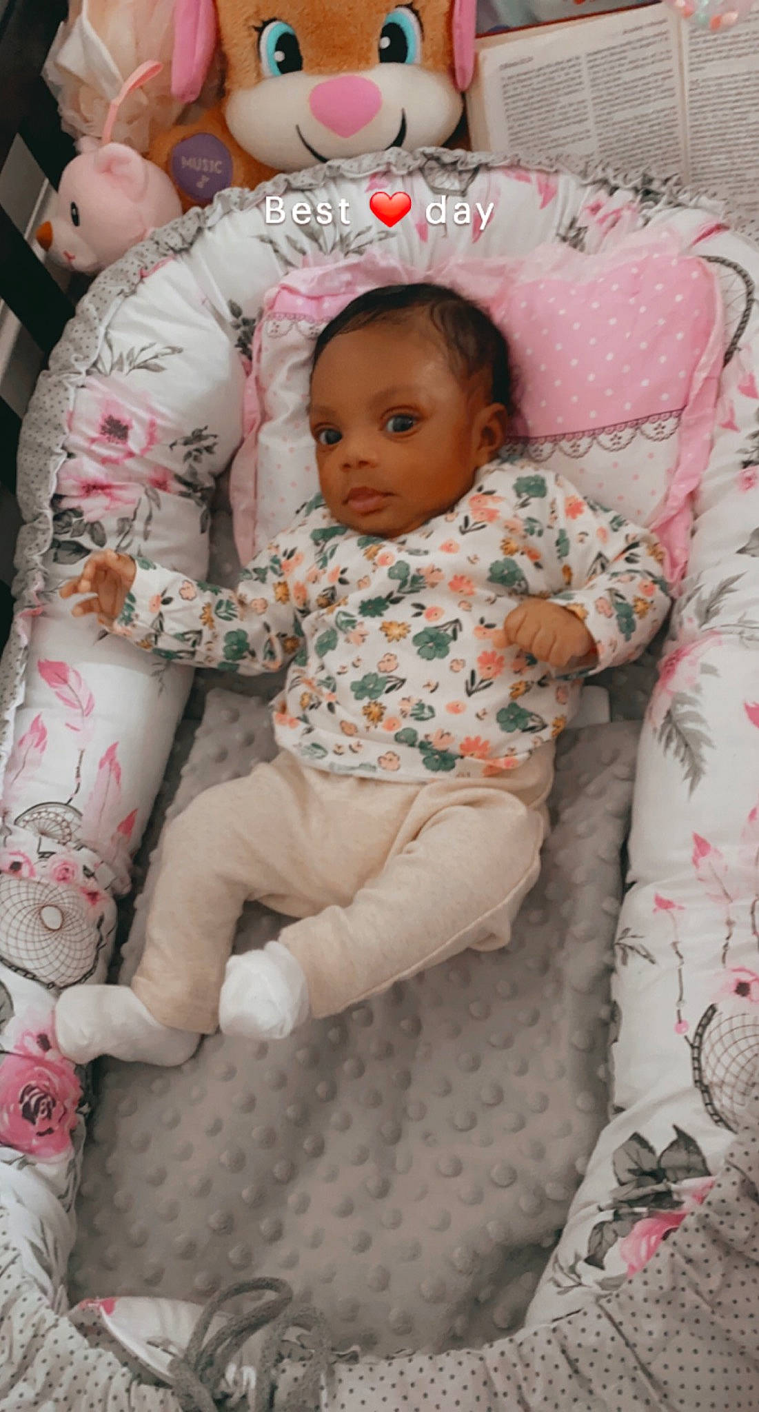 Carlisa joined the competition — help win amazing prizes! arm, baby, baby_toddler_clothing, bed, bedding, cheek, child, comfort, eye, face, head, human_body, linens, pattern, person, pink, sitting, skin, sleeve, textile