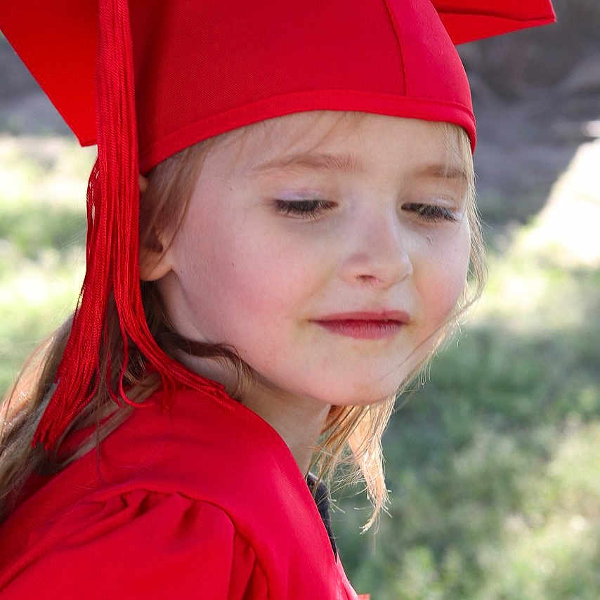 Skylarae is registered to the contest to win money with this photo: accessories, cap, child, clothing, dress, earring, face, fashion, female, formalwear, girl, gown, graduation, hat, head, jewelry, people, person, photography, portrait