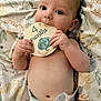 baby, infant, diaper, blanket, dinosaur, card, milestone, cute, cheeks, hand, face, lying_down, skin, eyes, mouth, fingers, soft, child, portrait, indoors