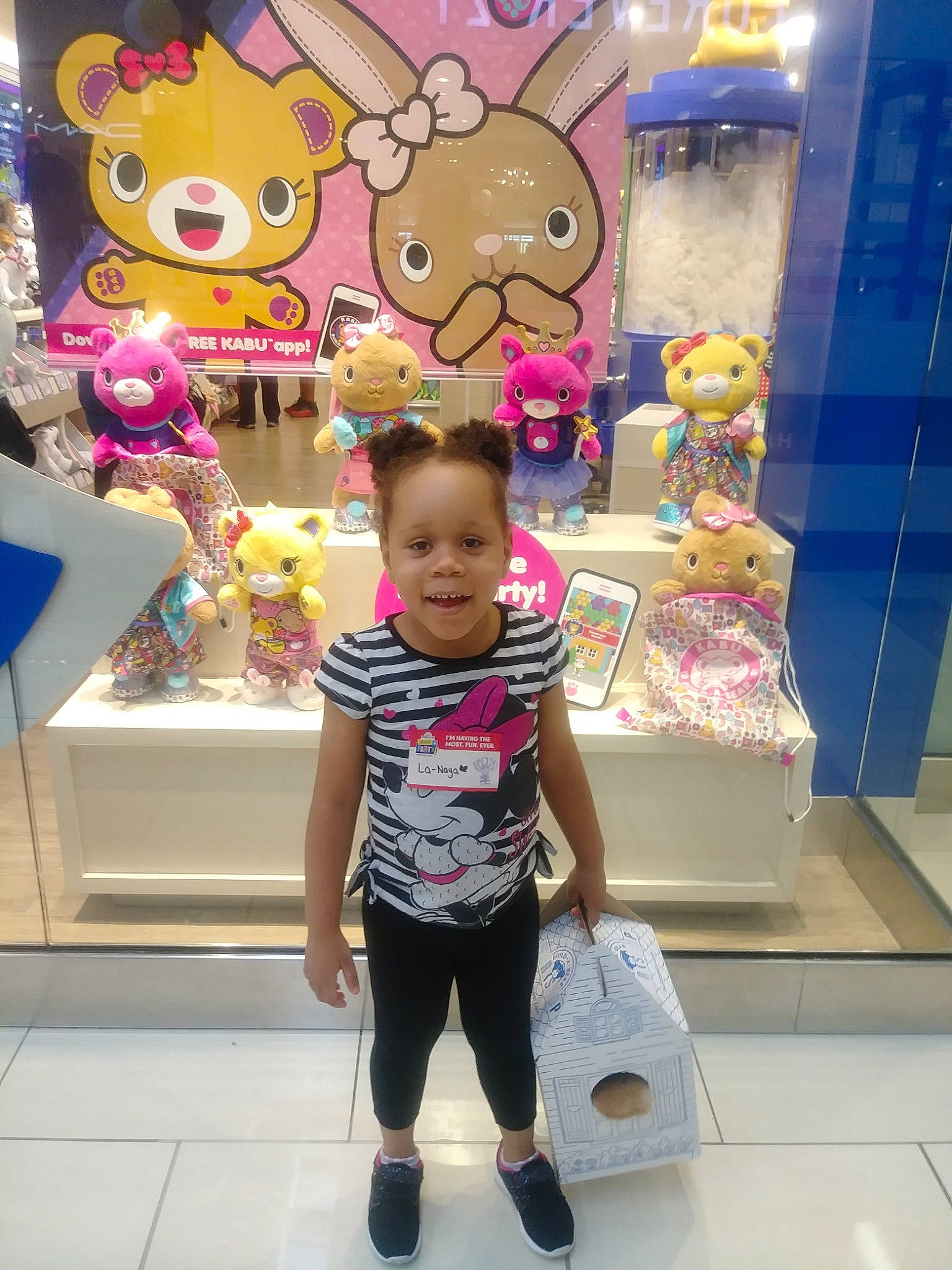 La'Naya is registered to the contest to win money with this photo: child, ear, fawn, fun, happy, joy, person, pink, shopping_mall, smile, toddler, vacation
