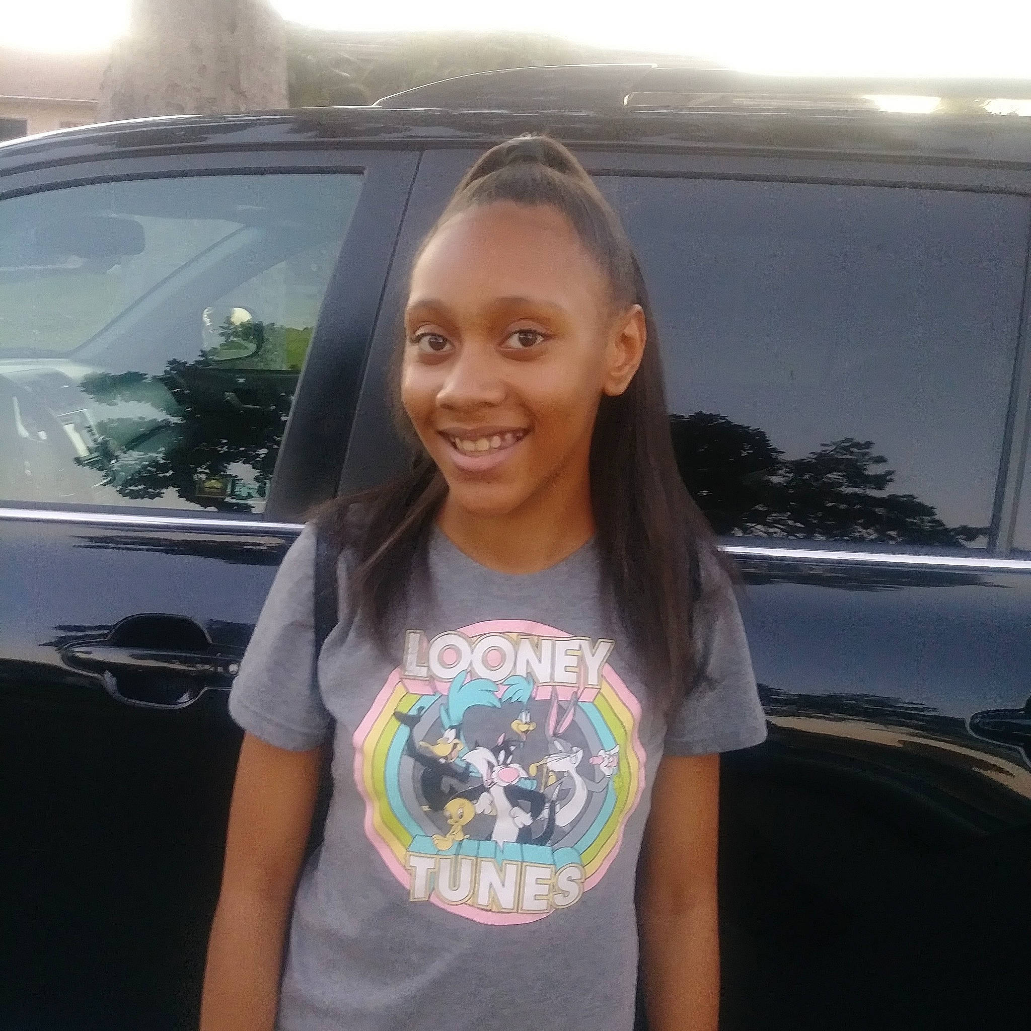 La'Maya is registered to the contest to win money with this photo: auto_part, car, cool, family_car, happy, joy, person, photography, smile, t_shirt, vacation, vehicle, vehicle_door