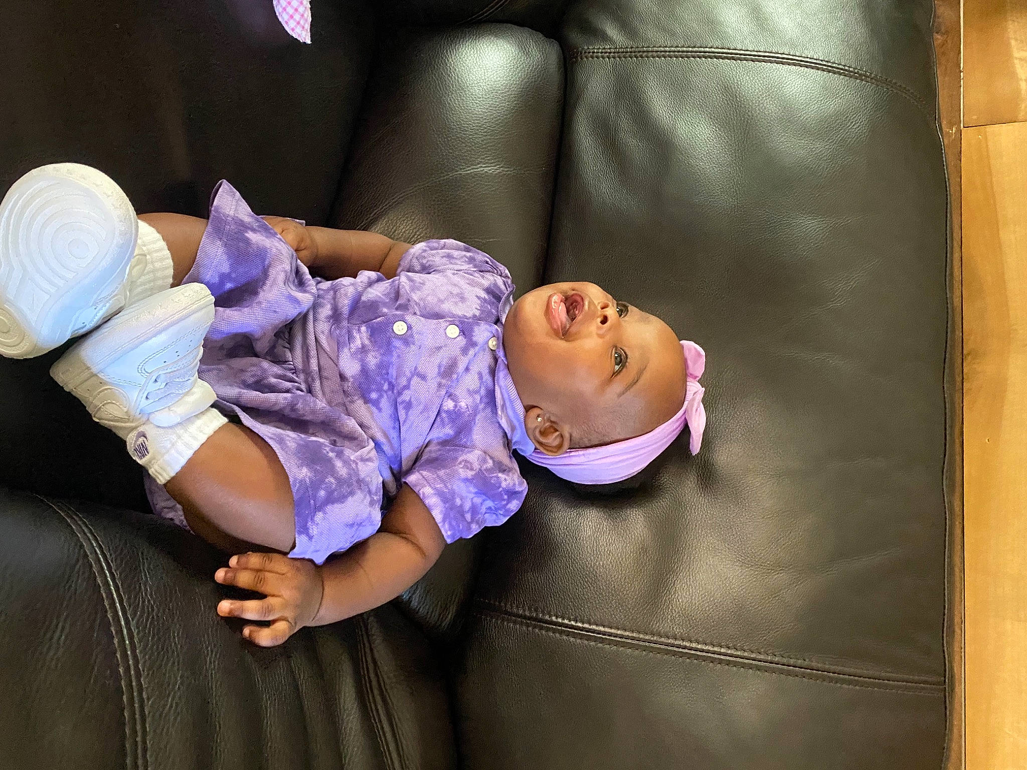 Kamaria joined the competition — help win amazing prizes! baby, baby_toddler_clothing, cap, child, comfort, couch, flash_photography, fun, hat, human_body, human_leg, leisure, magenta, person, purple, room, sitting, textile, thigh, toddler