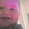 Isaac is registered to the contest to win money with this photo: baby, child, face, smile, happy, indoor, closeup, person, skin, head, infant, cheek, mouth, tongue, eye, clothing, expression, human, portrait, light