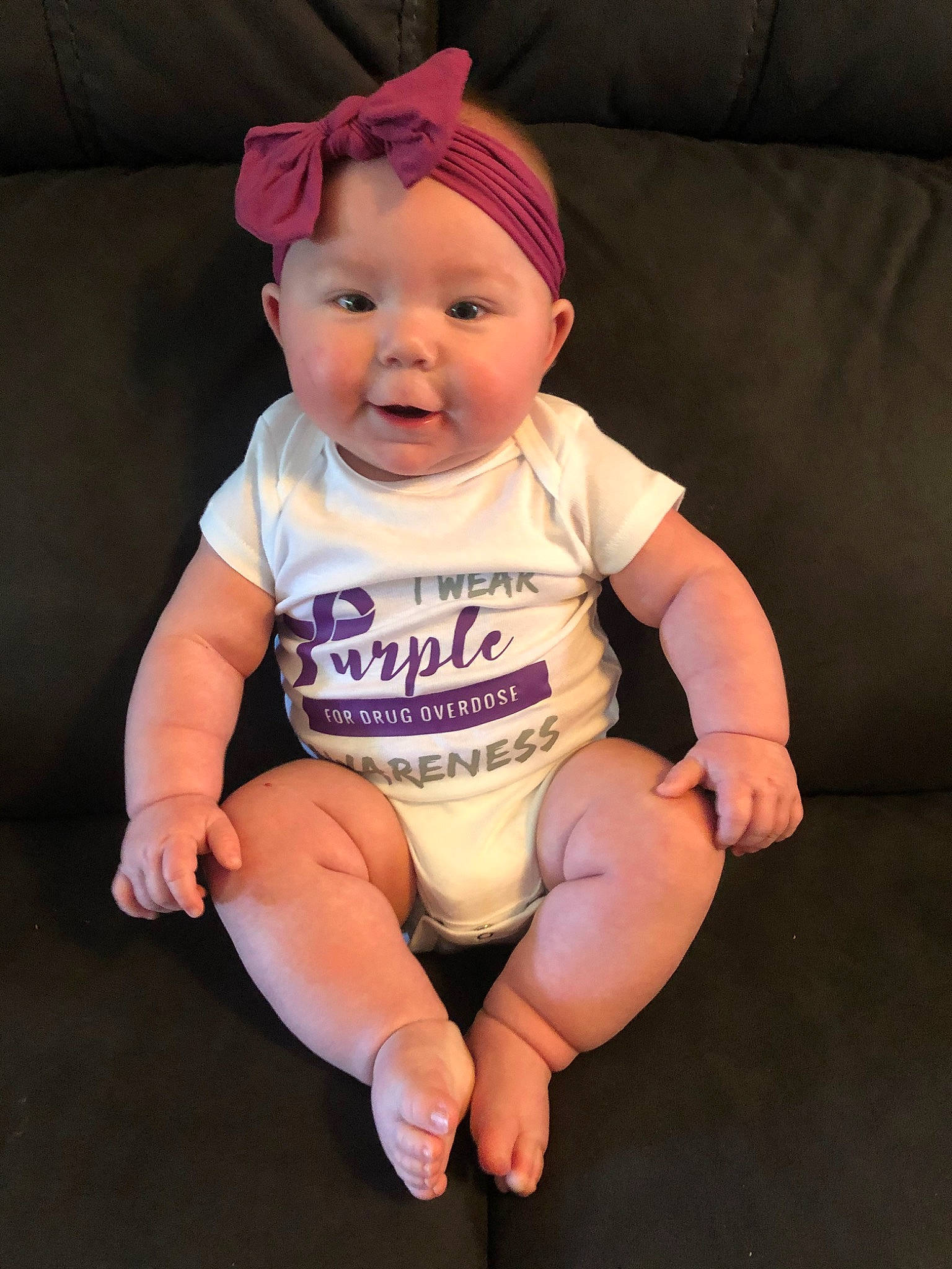 Brooke is registered to the contest to win money with this photo: baby, baby_toddler_clothing, cheek, child, head, headgear, headwear, person, pink, product, sitting, skin, sleeve, smile, toddler