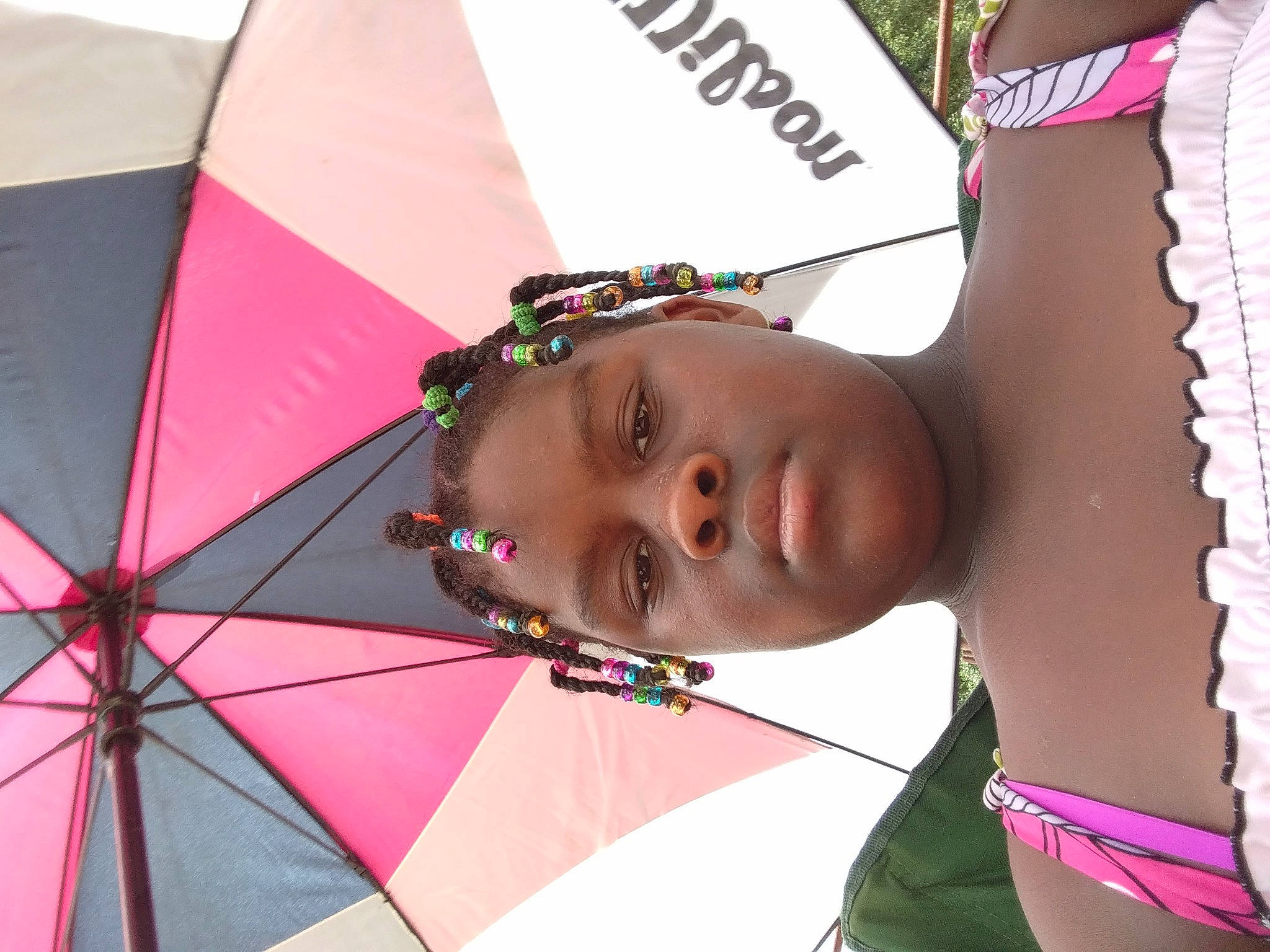 Jameica is registered to the contest to win money with this photo: black_hair, chest, child, event, eyewear, fashion_accessory, fun, happy, jewellery, leisure, lip, magenta, pattern, person, pink, skin, tints_and_shades, tree, tribe, trunk