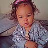 Malanii joined the competition — help win amazing prizes! toddler, child, baby, curly_hair, pink_bows, pajamas, bed, pacifier, baby_bottle, indoor, person, cute, sitting, cozy, expression, clothing, face, hands, soft_lighting, portrait