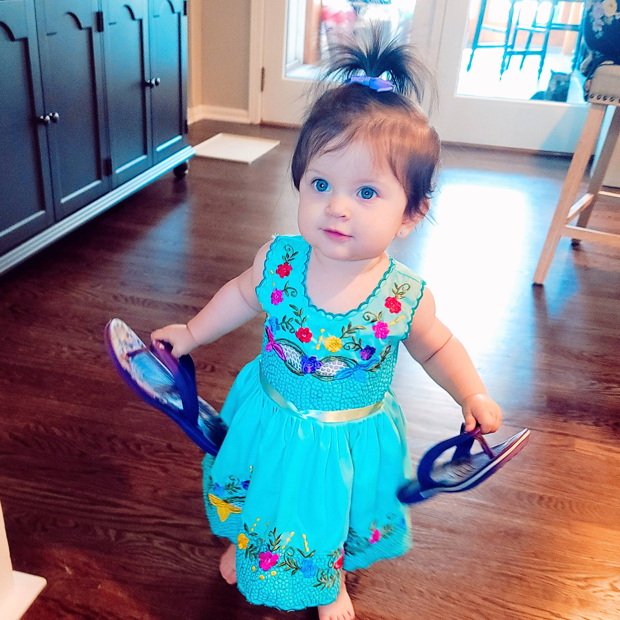 Rosa is registered to the contest to win money with this photo: azure, baby_toddler_clothing, blue, cabinetry, dress, floor, flooring, happy, iris, joint, person, photograph, pink, purple, skin, sleeve, standing, toddler, waist, white