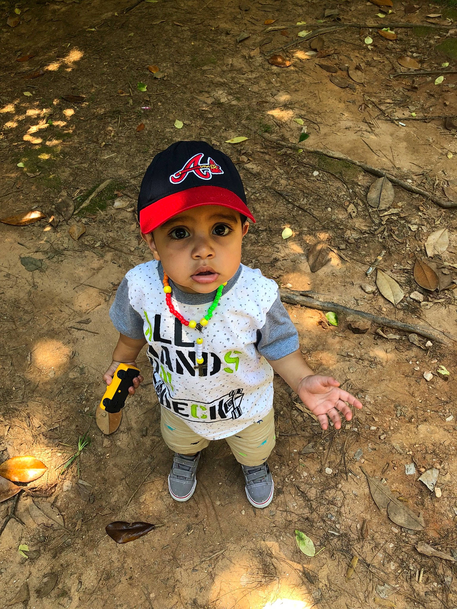 Damian is registered to the contest to win money with this photo: adaptation, child, fun, headwear, person, play, smile, soil, toddler